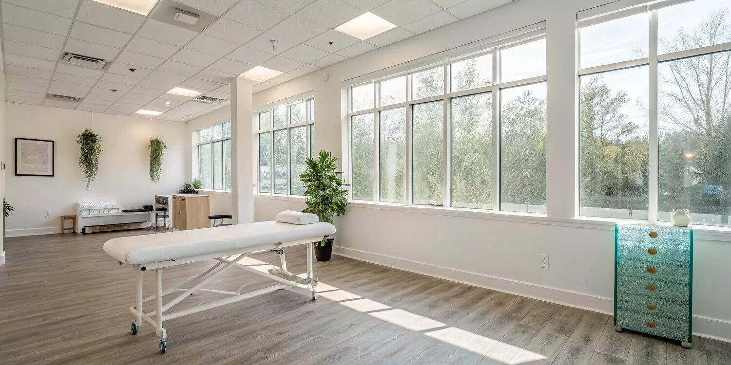 A bright, modern chiropractic office, a key benefit of a wellness membership plan.
