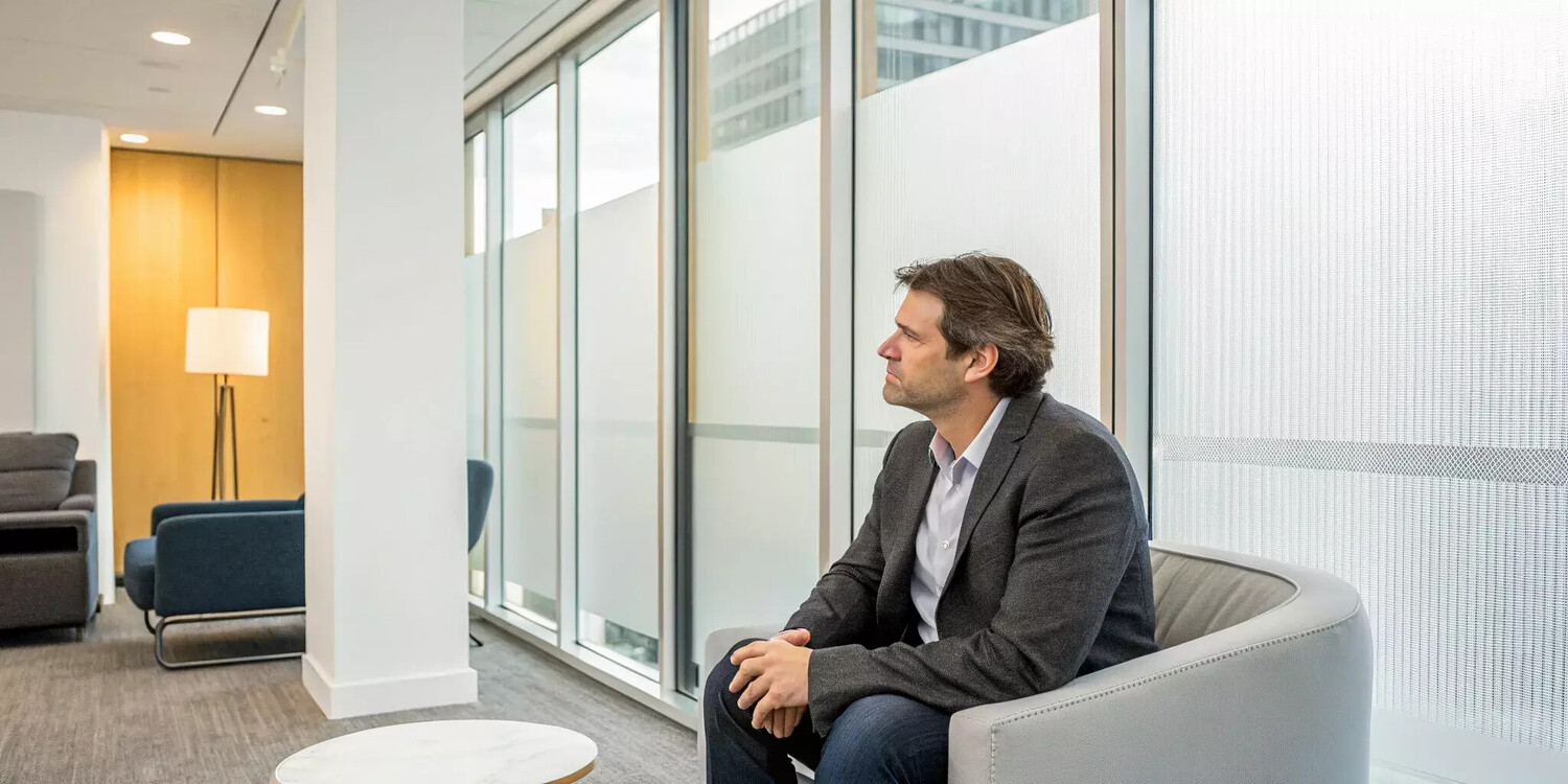 Man thoughtfully considering the benefits of TRT for low testosterone.